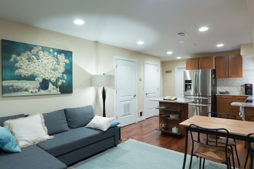 The washer/dryer is neatly tucked away behind the doors. Chilled filtered water and ice is always available from the refrigerator door.