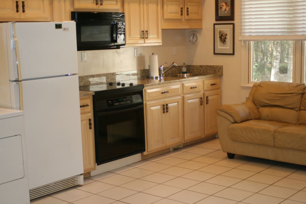 Fully equipped kitchen with pots pans, dishes just like home.