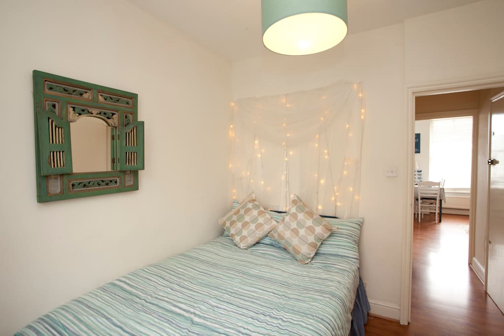 Bedroom with fairy light feature and Indian mirror