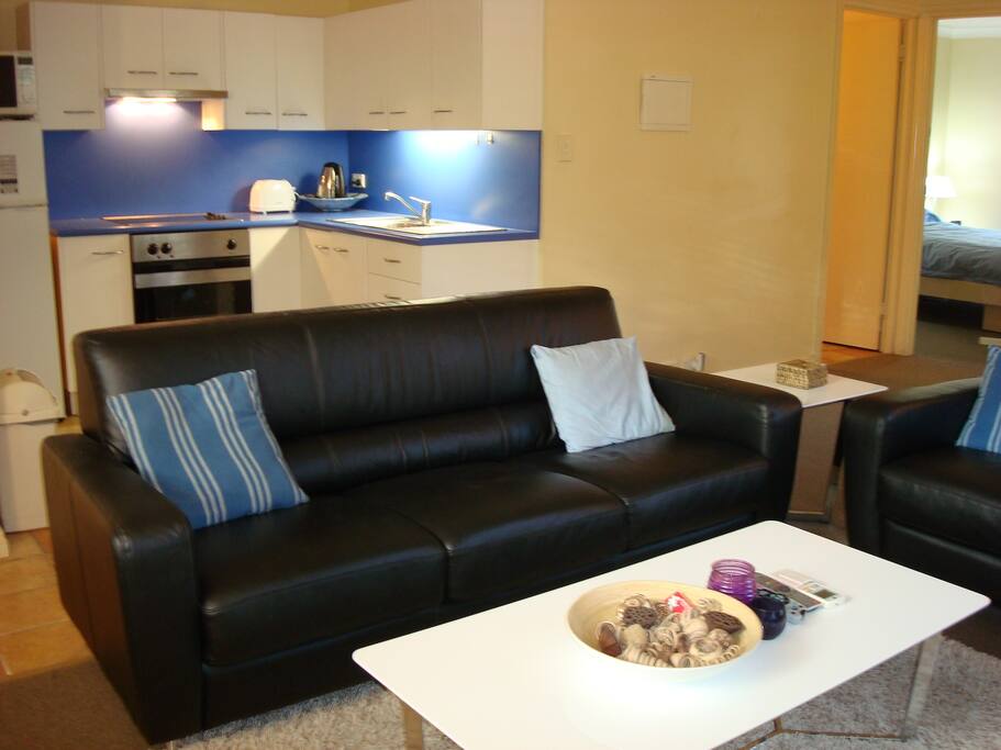 Kitchen with electric cooktop full under bench oven and fridge