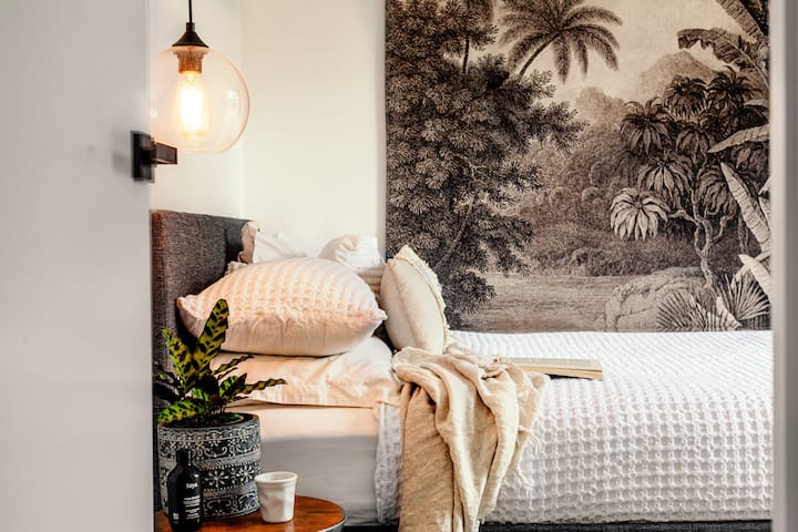 The second bedroom with double bed looking out to its own private courtyard. 