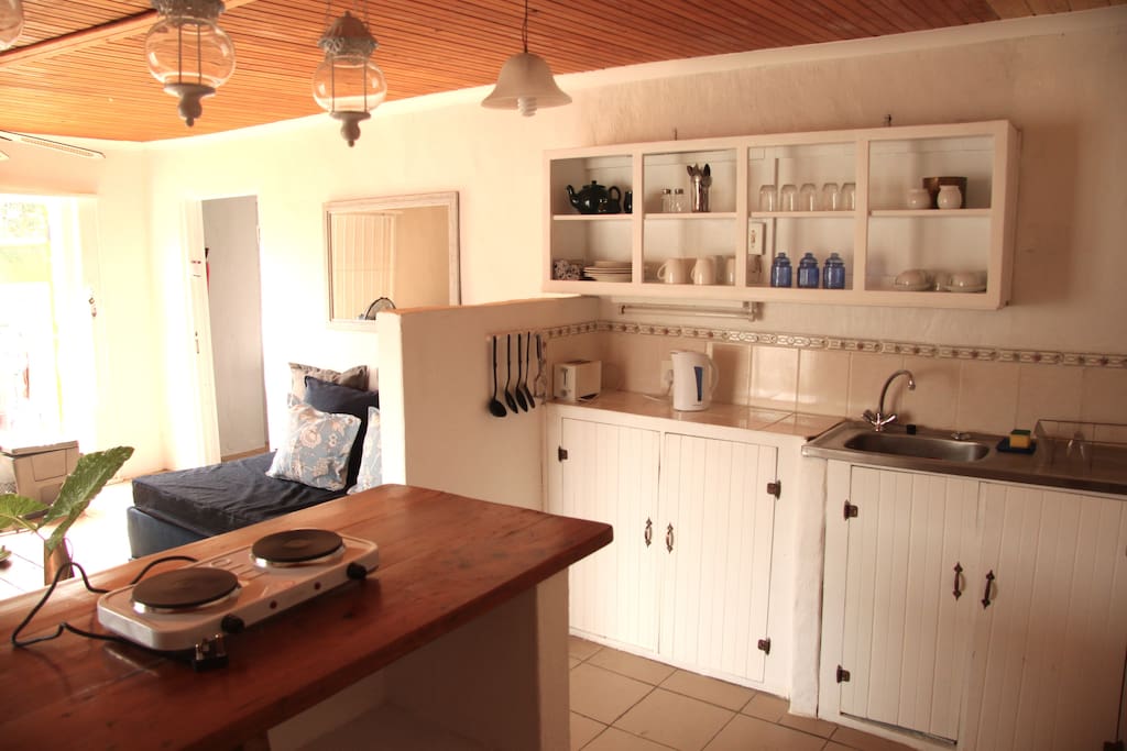 fully equipped kitchen with fridge, microwave and 2 plate stove. We provide tea,coffee,sugar and milk
