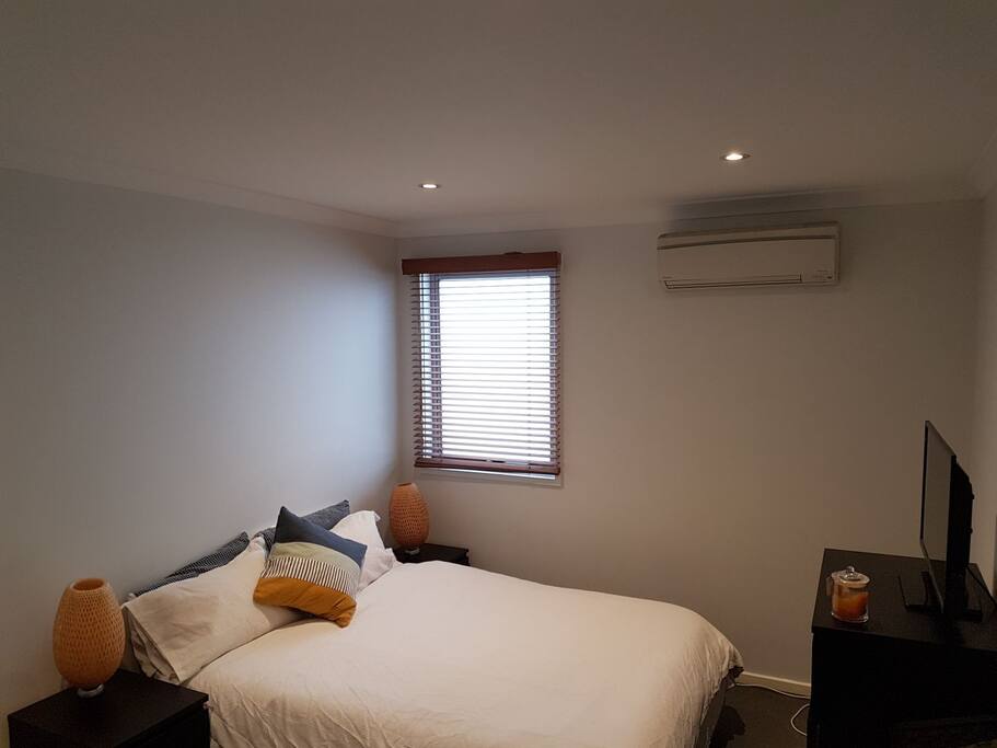 Room with Queen bed and TV