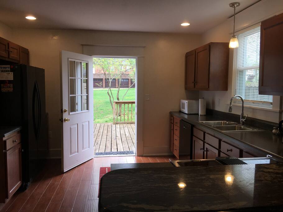 Large Fully Equipped Kitchen with door to Back Deck