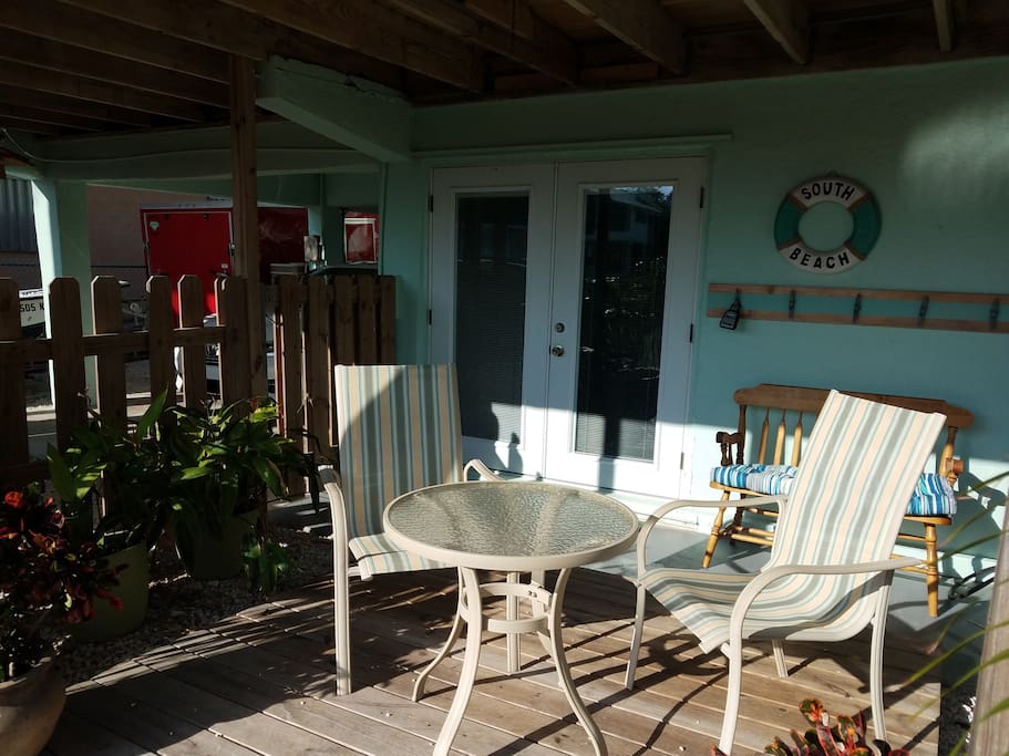 Private deck outside of apartment and cleats for hanging your wet bathing suits and towels.