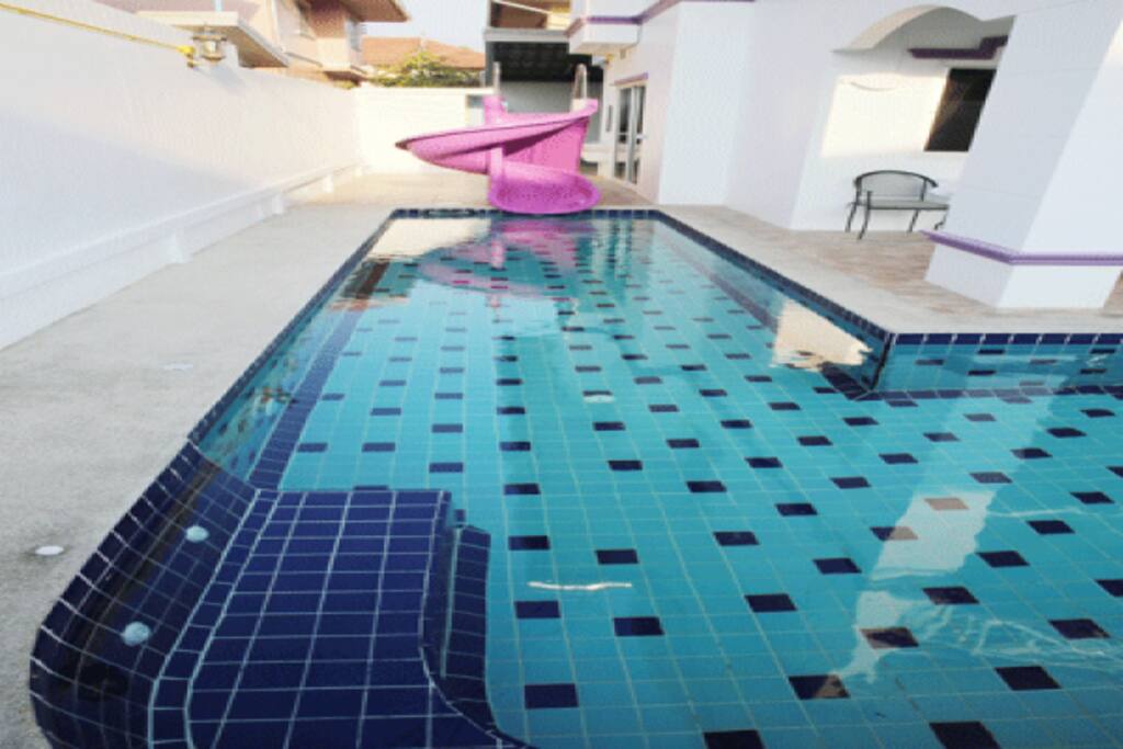 The pool has a waterslide for the kids