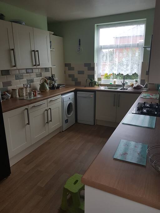 Kitchen with use of dishwasher, washing machine, dryer and large americam fridge freezer.