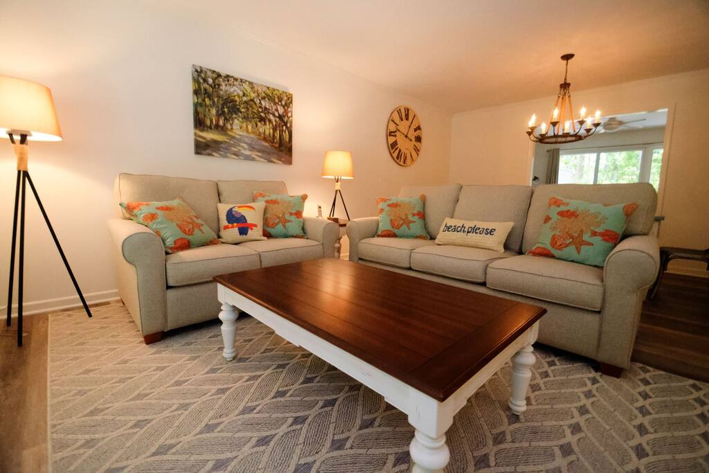 The living area is beautiful, large windows, new furnishings and a flat screen TV.