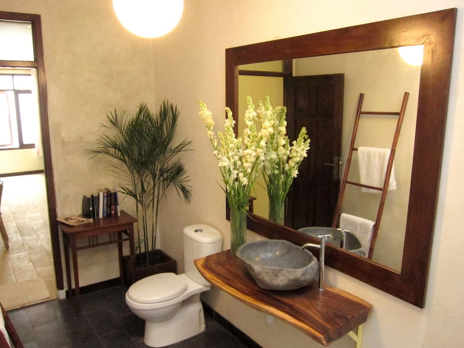 Stoned wash basin with cozy bath deco room with hot n cold water