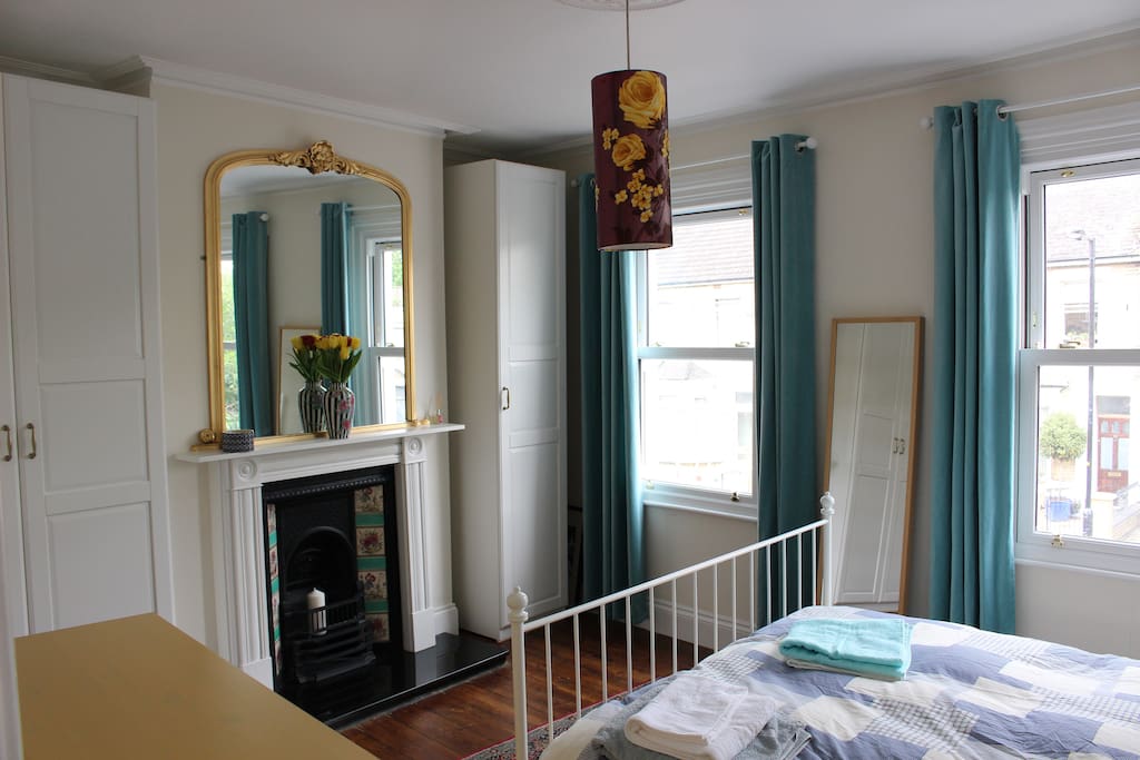 Master bedroom with decorative Victorian fireplace