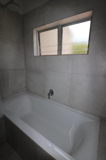Second bathroom with bath/shower combi