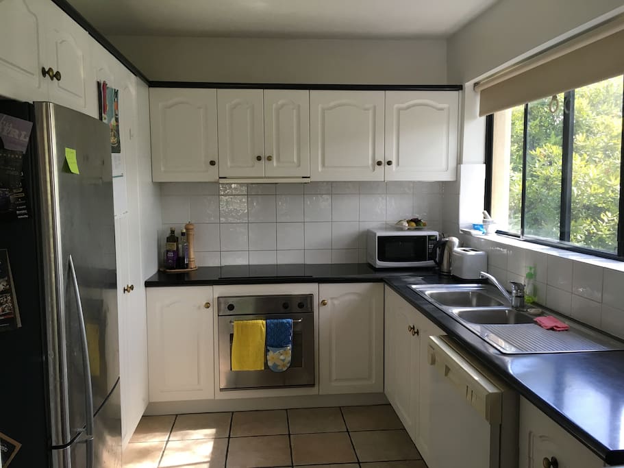 Tidy kitchen area with all the necessities.