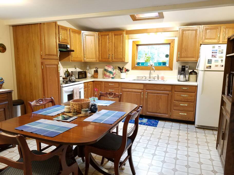 Bright, open eat-in kitchen with skylight