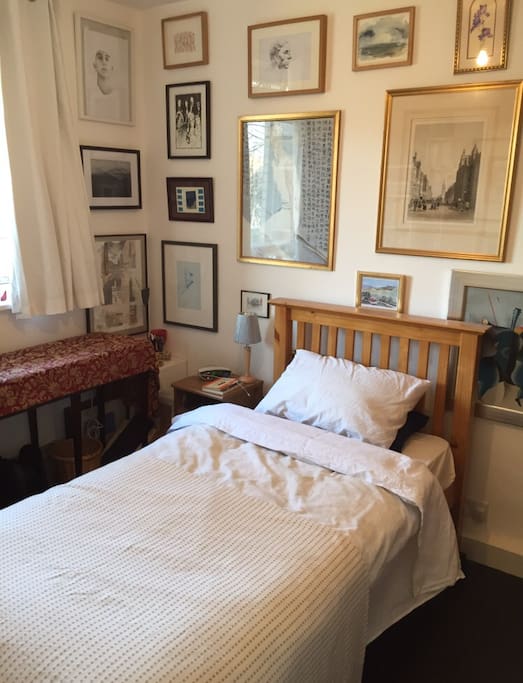 The guest bedroom. A comfortable single bed with a wardrobe. Many books and paintings. You are very welcome to use the rest of the apartment during your stay.