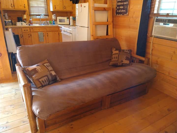 Full size bed with slide out drawers, extra linens, pillows.