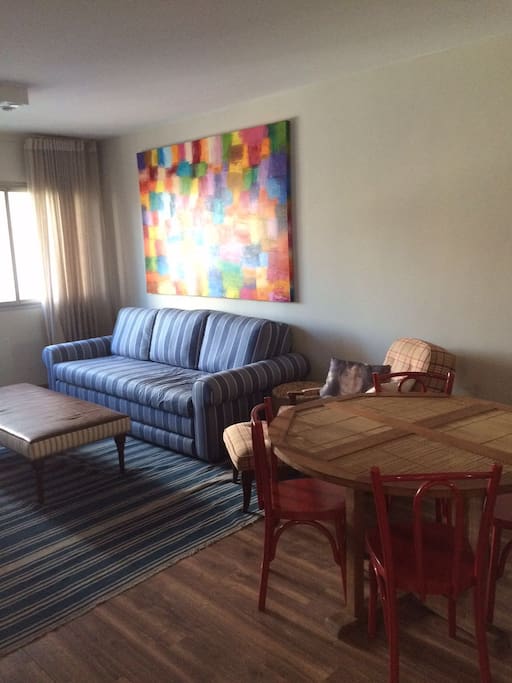 Living Room & Dinner Table. This couch becomes another bed.