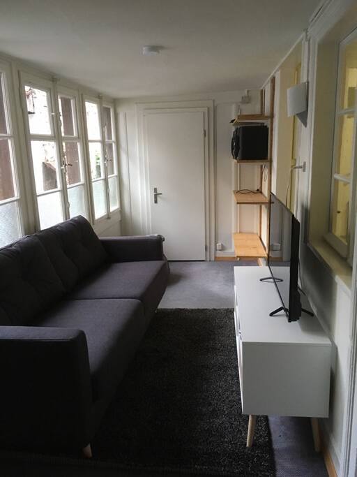small television room next to kitchen