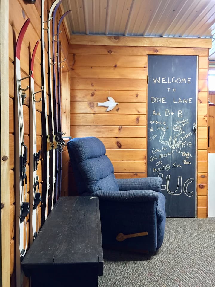 This is your view going down the steps. notice the key hanging on the ski on your left!
Welcome note on the small door ahead and the wifi info!