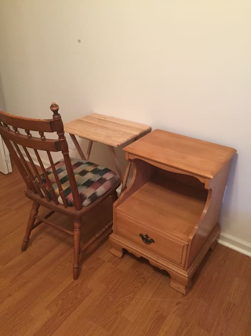 Small work space for laptops or iPads next to outlets.