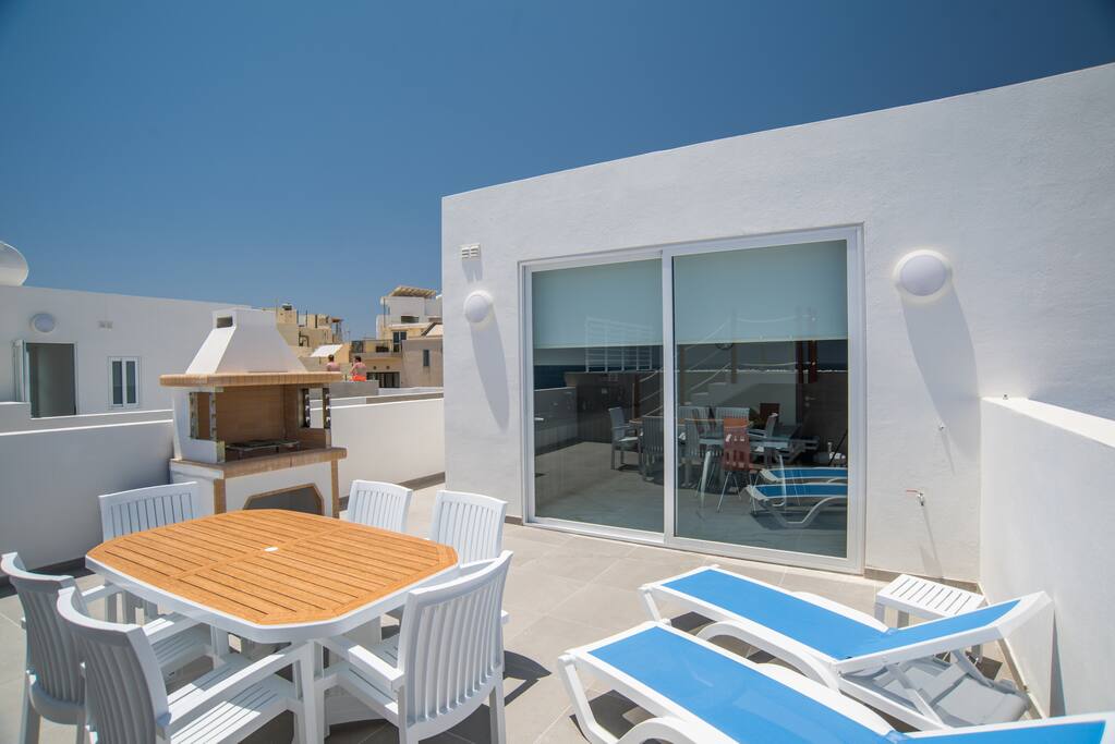 Outdoor Area; Table, Chairs, Sun Loungers and barbecue