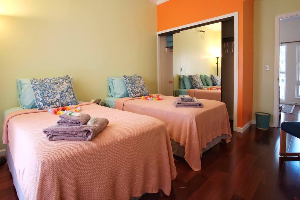 A mirrored storage closet has space for your luggage and hanging garments. We left the door open to show you the top floor hallway with entry door. You can use outside and indoor stairs to reach your floor.