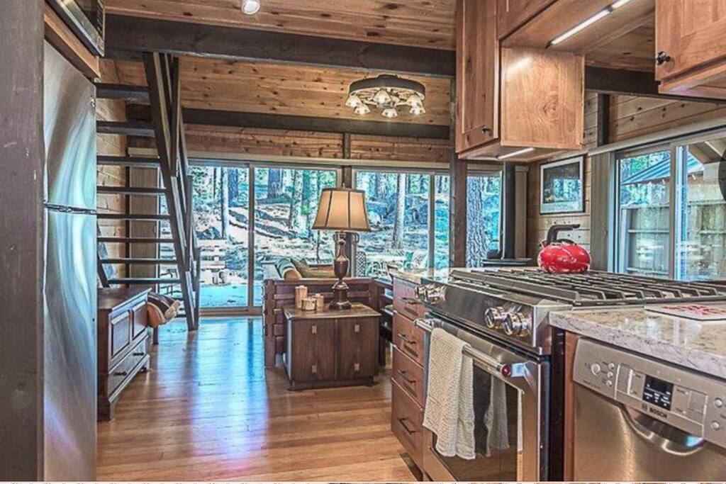 Remodeled kitchen with top-of-the-line appliances including Kitchen Aid gas range, Bosch dish washer, microwave and Keurig coffee maker.