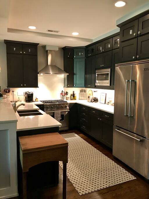 Chef’s kitchen with marble countertops and Viking appliances.