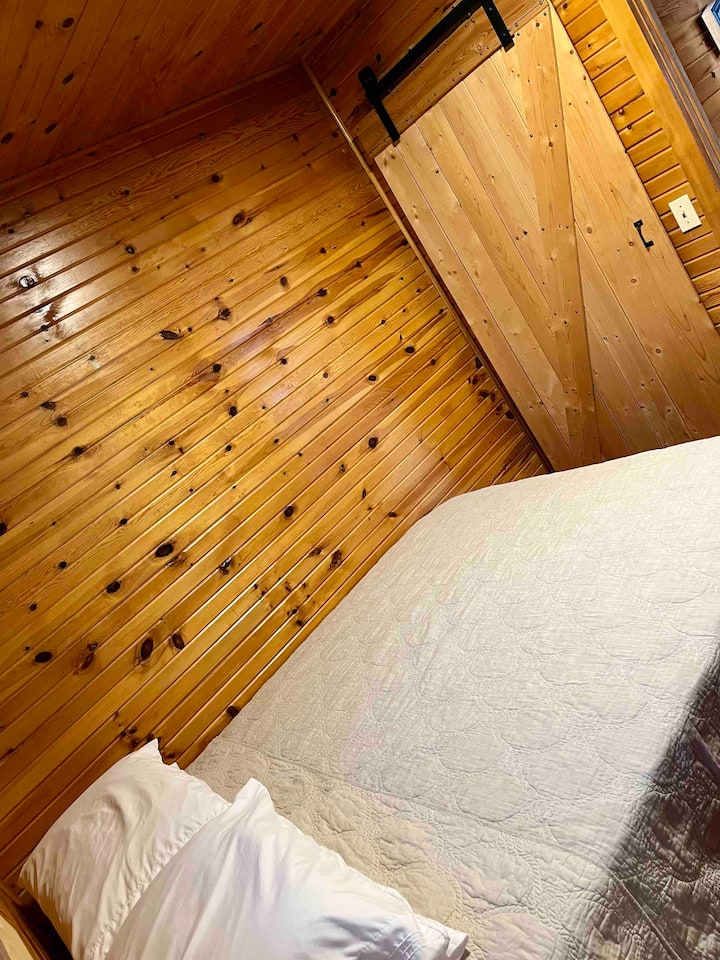 Main floor bedroom with sliding barn door.