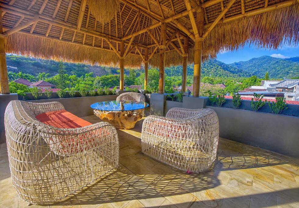 Rooftop covered garden, entertaining area, including fridge and BBQ.