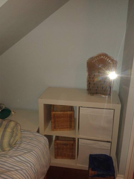 Mirror more storage and a kettle in the room