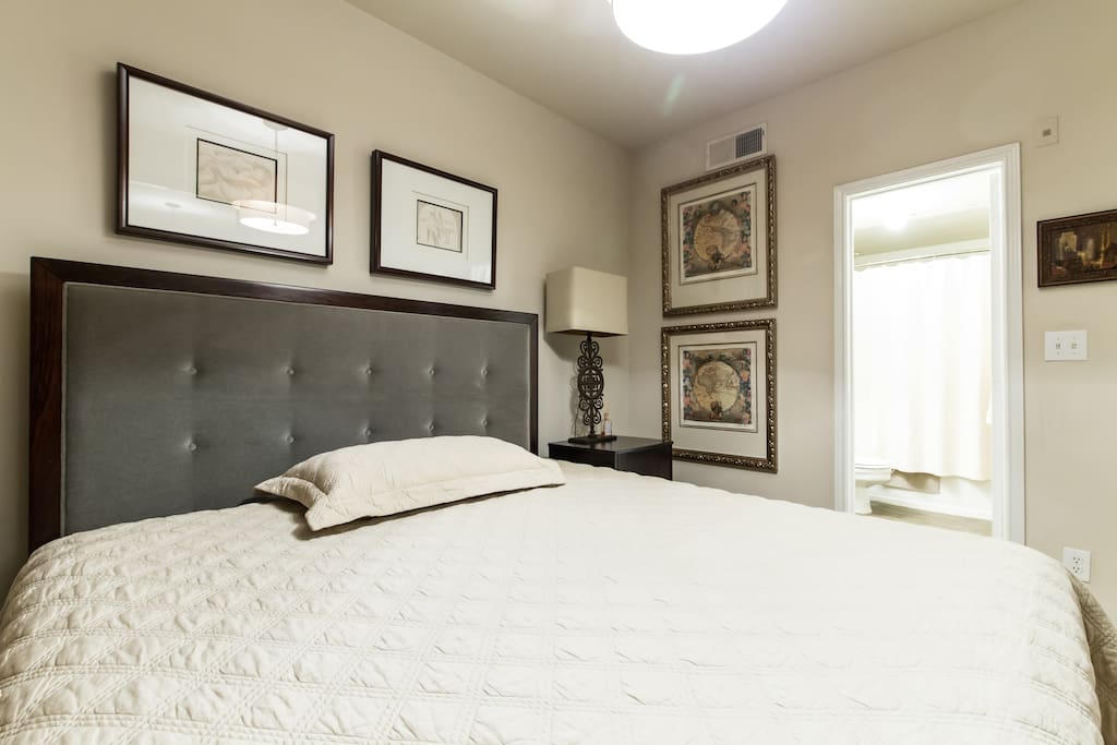 King bed with view of your attached private bath.