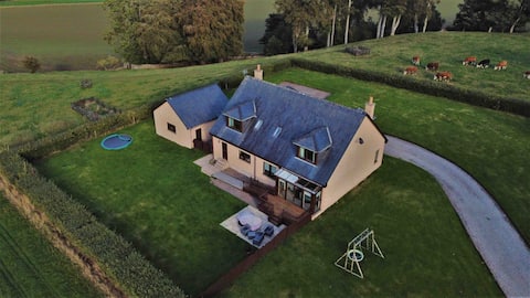 Modern country farmhouse with stunning river views