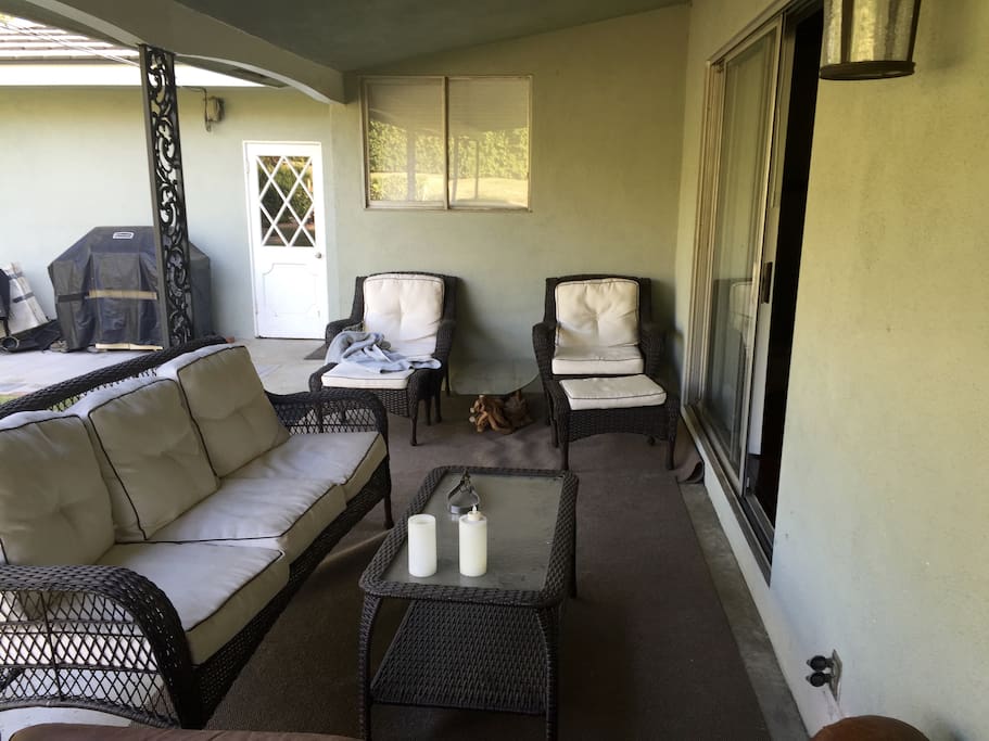 large open porch between the living room and the back yard. Great for evening cocktails or games with kids