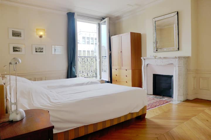 2nd Bedroom offers 2 single beds, has a large window & a decorative fire place.