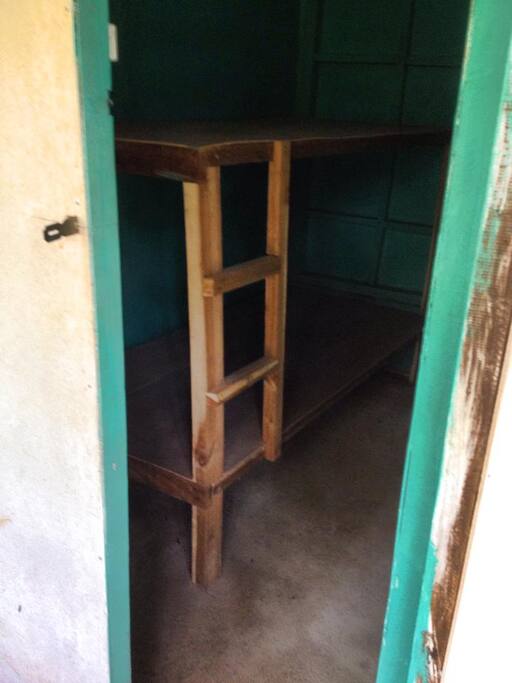 it has double deck bedroom, complete with all bedding's needed by the guest and a fan only