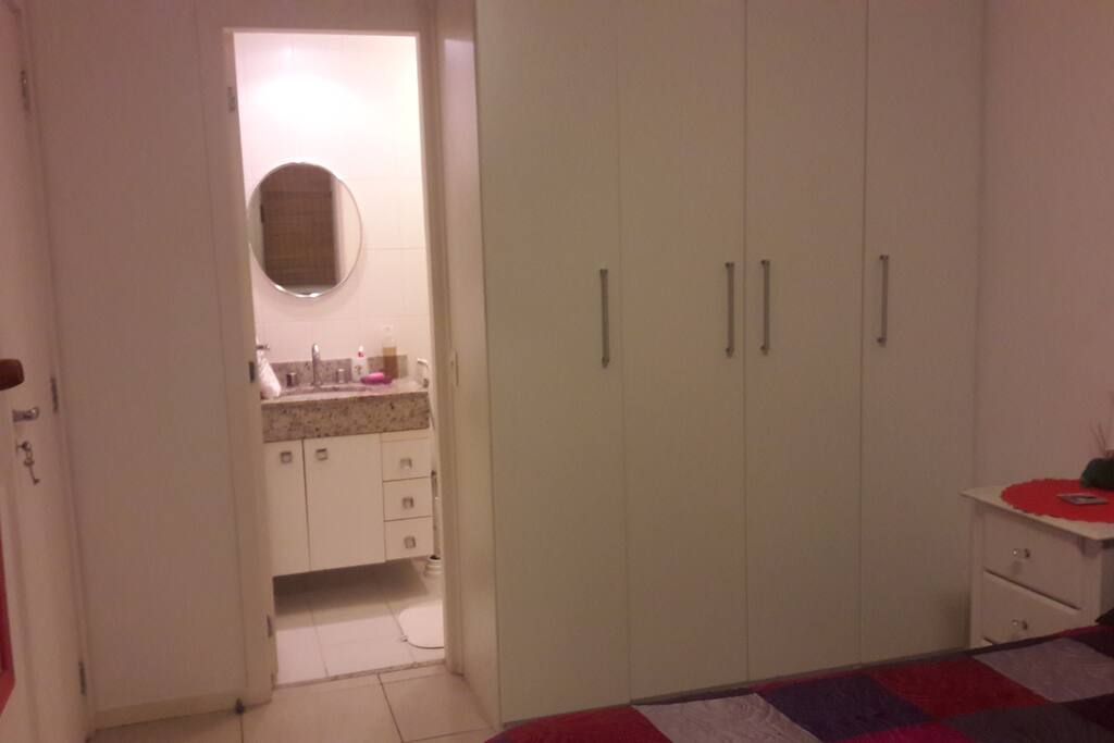 View of the room with the en suite bathroom and the closets.