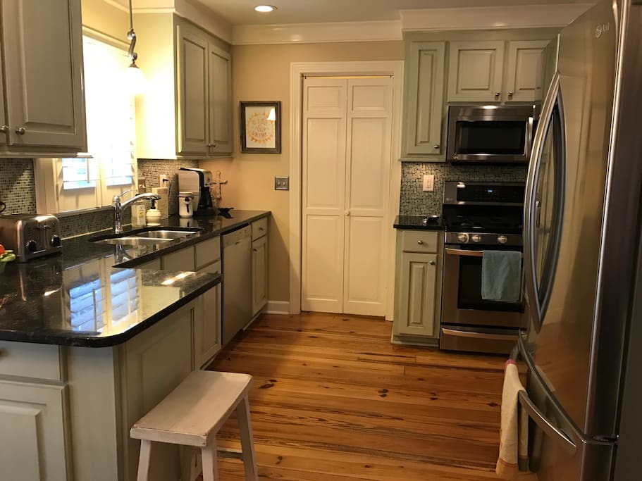 Fully equipped kitchen with gas stove, granite countertops, stainless appliances
