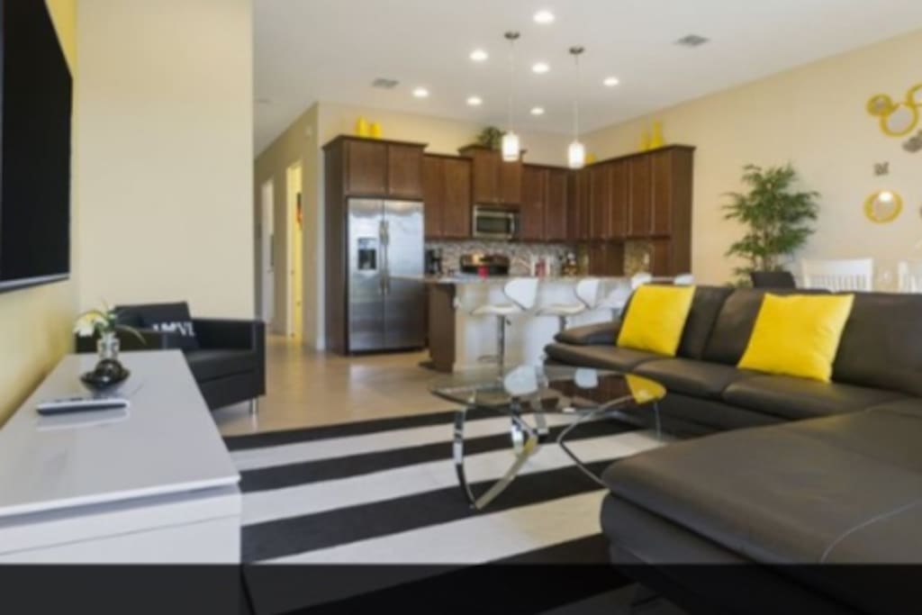 Spacious family room with 65" TV and DVR player