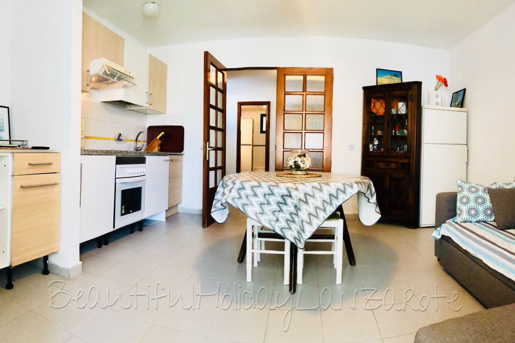 living room with tv, wifi and kitchen area