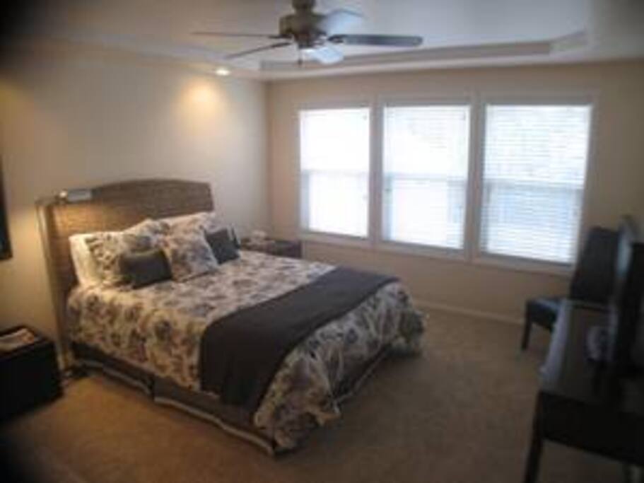 Spacious Master Suite with Coffered Ceiling