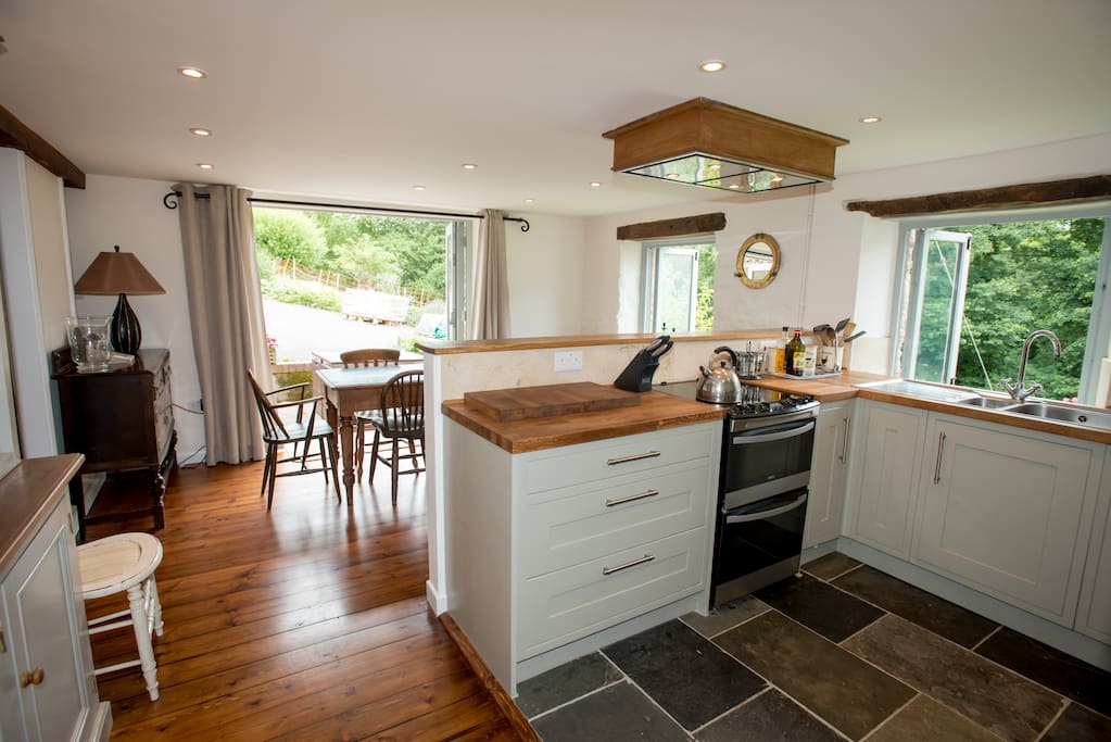Well Equipped Kitchen with Cooker Microwave, Dishwasher and Welsh Dresser over looking the Garden