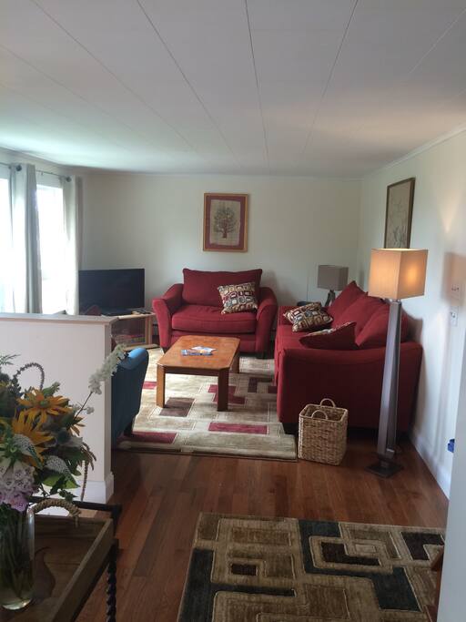 Living room with water view, TV