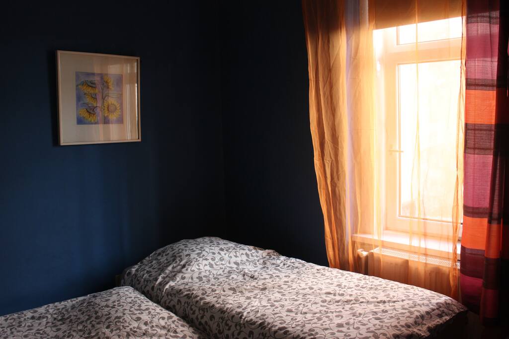 The appartment has a flowing, circular structure. The blue bedroom has a peaceful vibe to it.