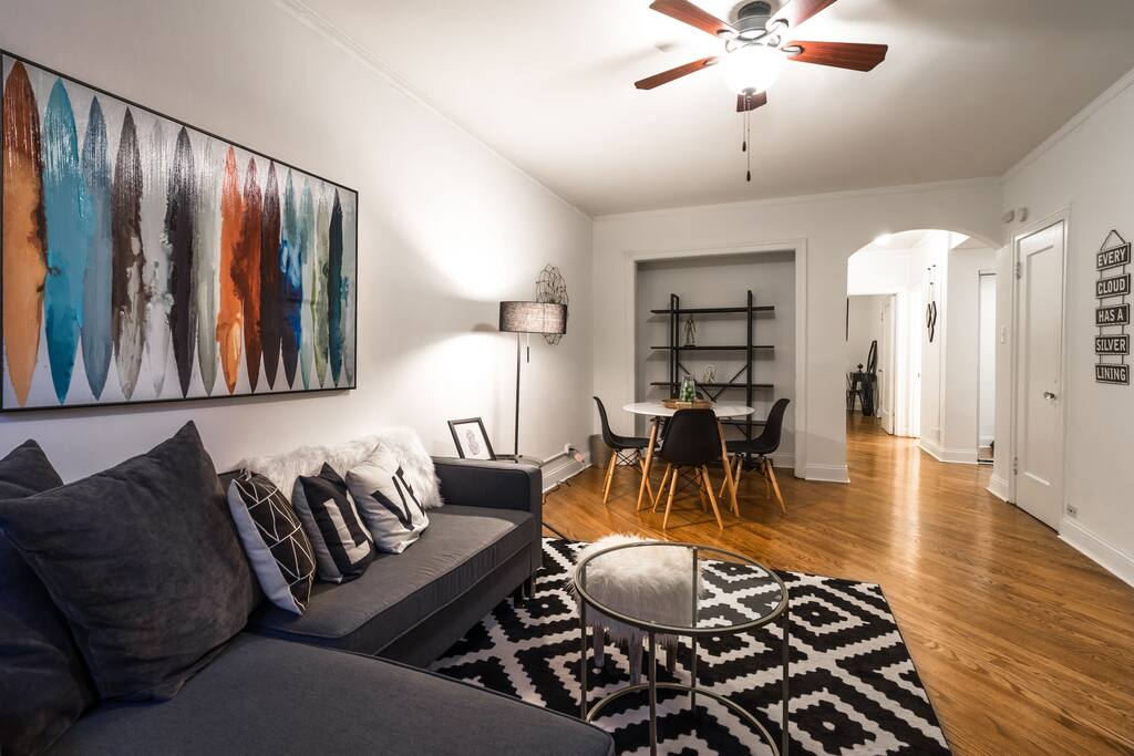 Comfortable living & dining room with views down Rush and State Street!