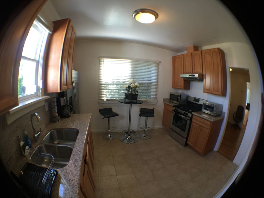 Sunny kitchen with all amenities. Feel free to use what you need to cook and feel at home.