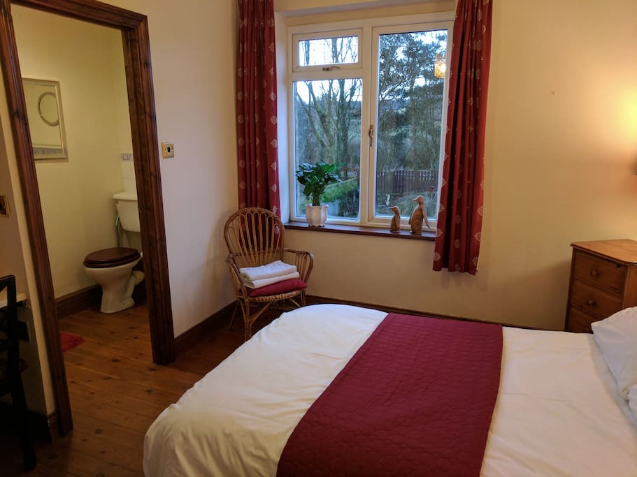 Master bedroom with en-suite bathroom has a south facing window over the garden and Hadrian's Wall