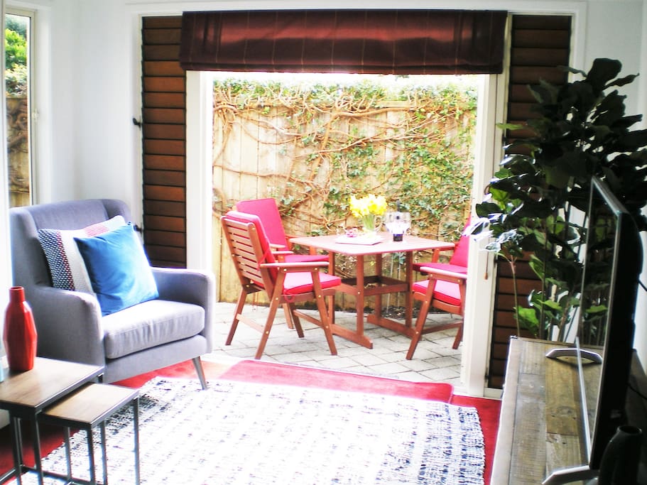 Lounge open plan to sunny patio