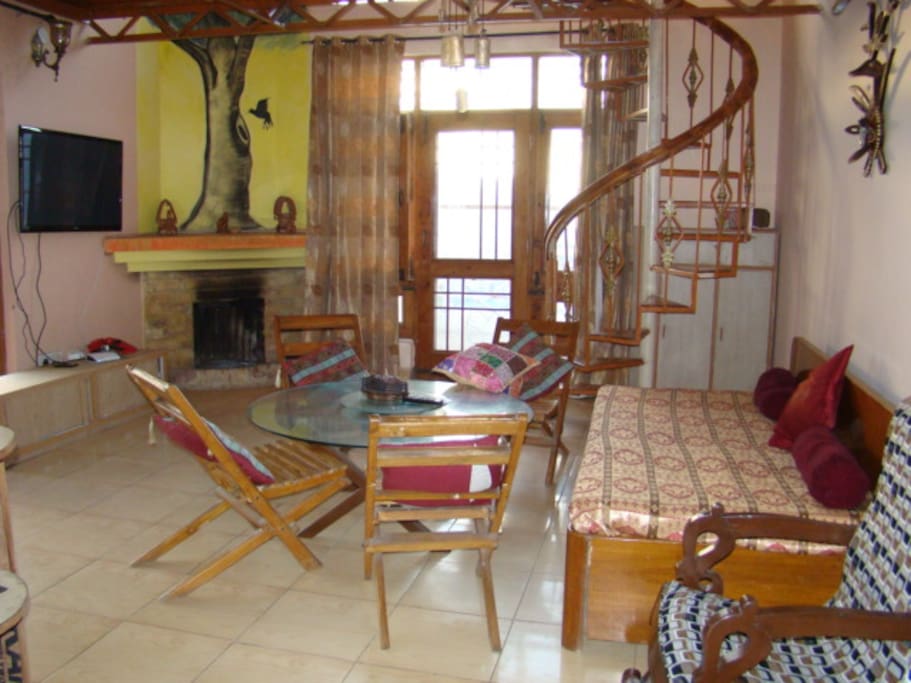 Spiraling Stairs from livingroom of lower floor to Bedroom on upper floor