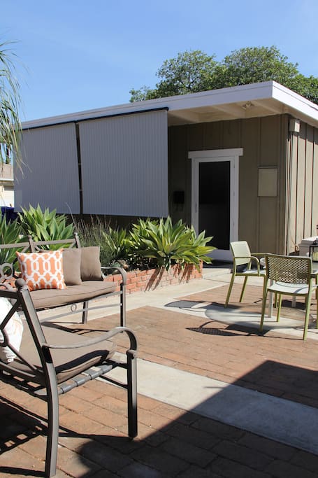 Private, backyard bungalow with sunshades and a/c to keep you cool.