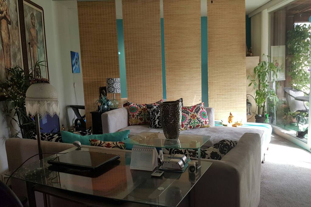 Large living space with desk area. Couch can easily transform into extra sleep area for 2.
